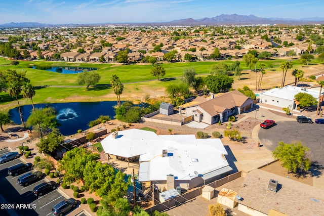 birds eye view of property with a water and mountain view