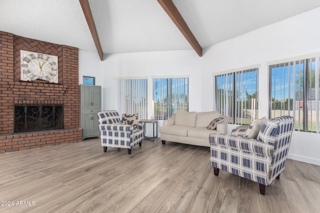 living room with a healthy amount of sunlight, wood-type flooring, and a fireplace