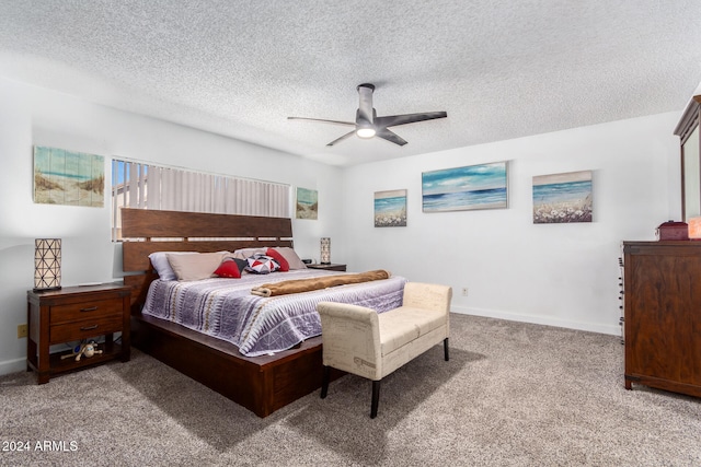 carpeted bedroom with a textured ceiling and ceiling fan