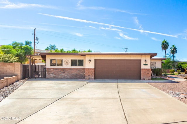 single story home with a garage