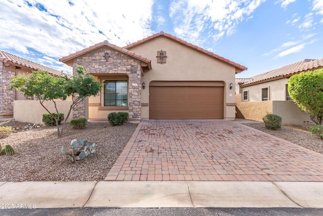 mediterranean / spanish-style house with a garage