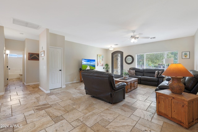 living room featuring ceiling fan