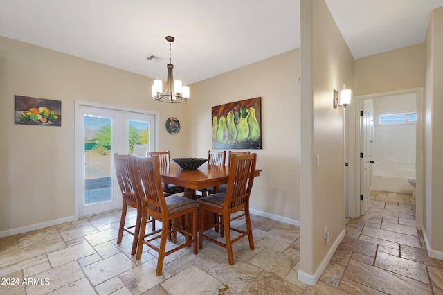 dining space featuring a chandelier