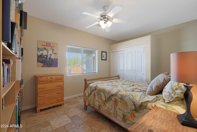 bedroom featuring ceiling fan and a closet