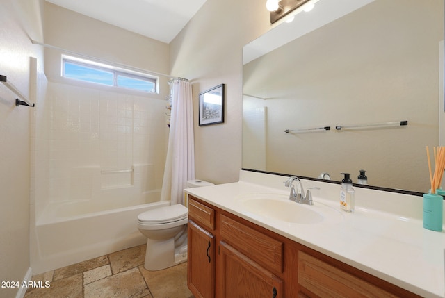 full bathroom with vanity, shower / bath combo with shower curtain, and toilet