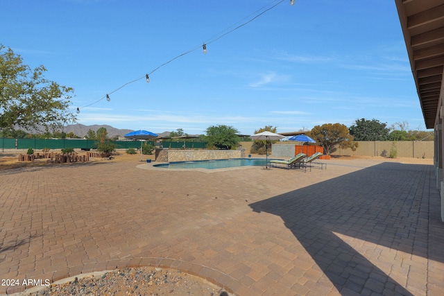 exterior space with a patio area and a mountain view