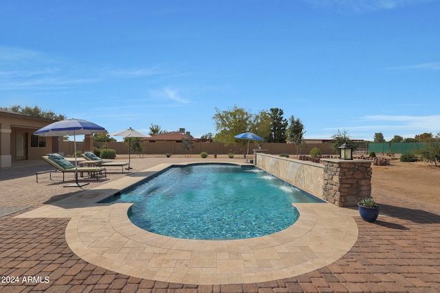 view of pool featuring a patio and pool water feature