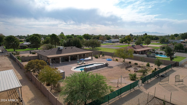 view of swimming pool with a patio and a hot tub