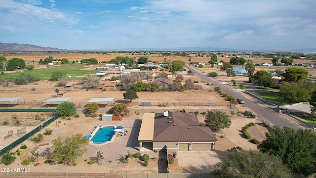 birds eye view of property with a mountain view