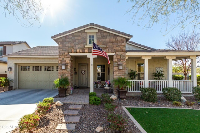 view of front facade with concrete driveway, stone siding, an attached garage, a porch, and stucco siding