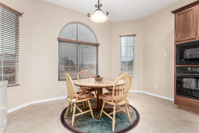 dining area featuring light tile patterned floors