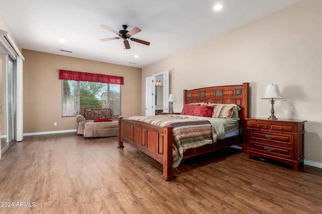 bedroom with ceiling fan and dark hardwood / wood-style floors