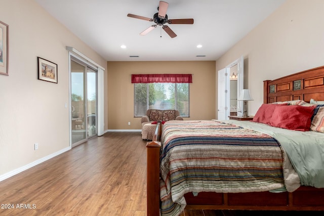 bedroom with ceiling fan, hardwood / wood-style floors, and access to exterior