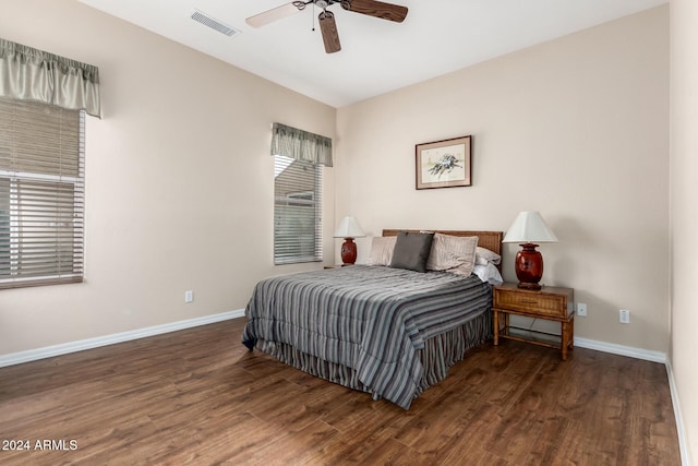 bedroom featuring ceiling fan and dark hardwood / wood-style flooring