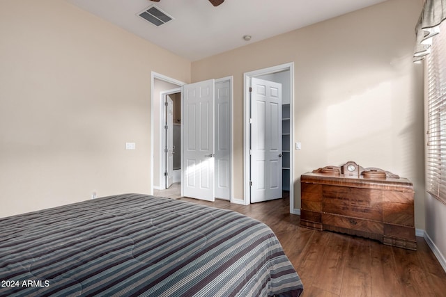 bedroom with dark hardwood / wood-style floors