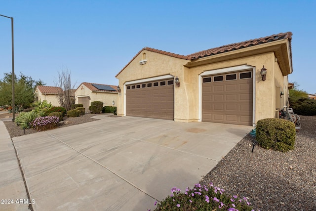 mediterranean / spanish-style home featuring a garage