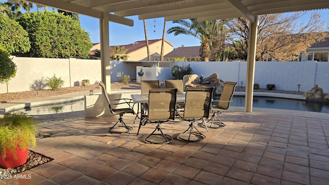 view of patio / terrace with a fenced backyard, a fenced in pool, a pergola, and outdoor dining space