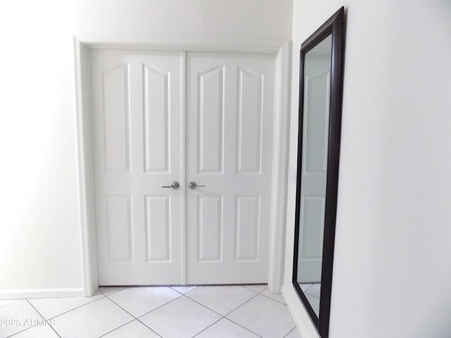 hallway with light tile patterned floors