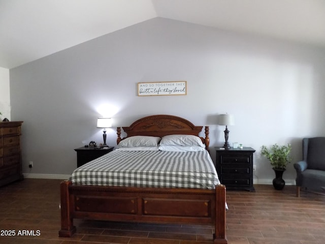 bedroom featuring dark wood-style floors, lofted ceiling, and baseboards