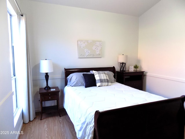 bedroom featuring wood finished floors