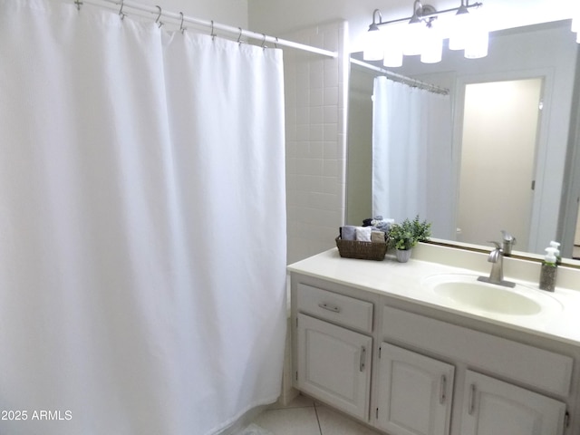 full bath with a shower with shower curtain, tile patterned flooring, and vanity