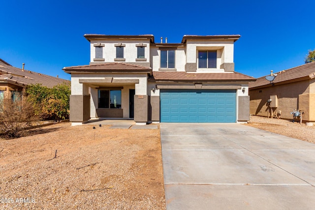 prairie-style house with a garage, a tiled roof, concrete driveway, and stucco siding