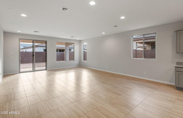 spare room with light tile patterned flooring