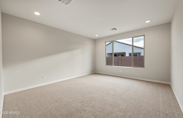 unfurnished room featuring carpet floors