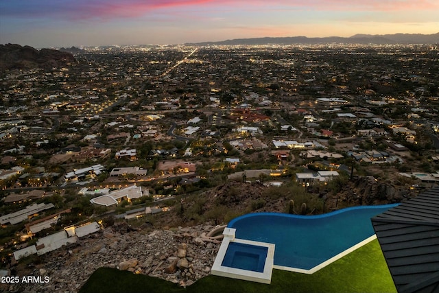 aerial view at dusk with a mountain view