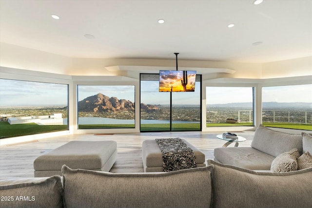 sunroom / solarium featuring a mountain view