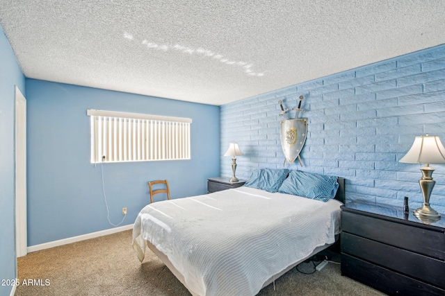 bedroom with carpet and a textured ceiling