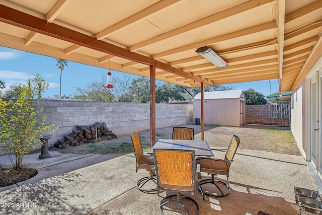 view of patio / terrace with a shed