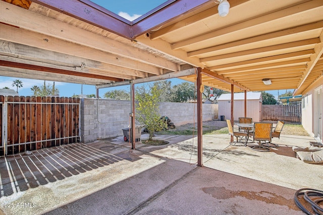 view of patio / terrace with a shed