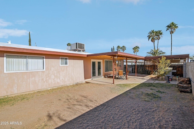 back of property with a patio and central AC unit