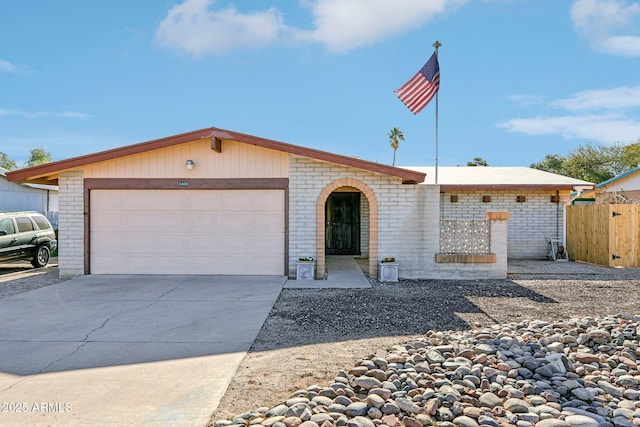 ranch-style home featuring a garage