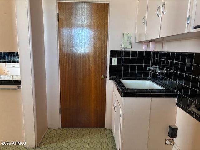 laundry area featuring a sink