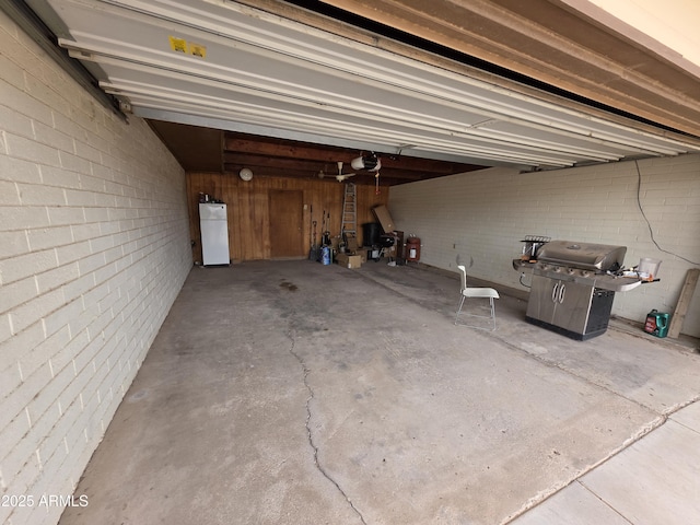 garage featuring freestanding refrigerator