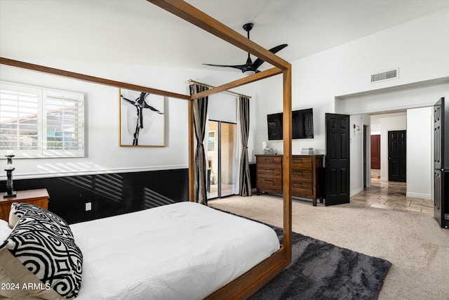 carpeted bedroom with ceiling fan and lofted ceiling