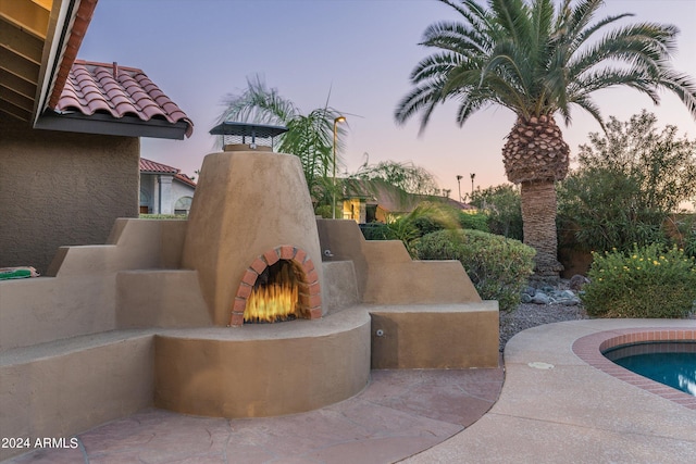 view of patio terrace at dusk