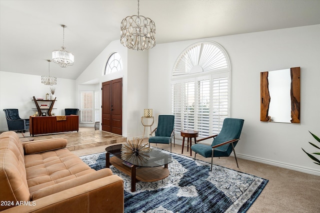 carpeted living room with a notable chandelier and vaulted ceiling