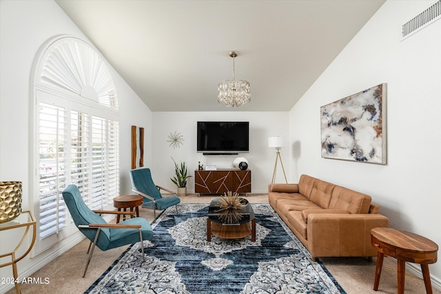 living room featuring carpet, vaulted ceiling, and an inviting chandelier