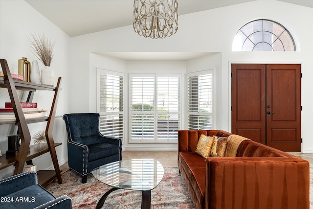 interior space with an inviting chandelier and lofted ceiling