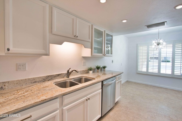 kitchen featuring a sink, visible vents, light stone counters, and dishwasher