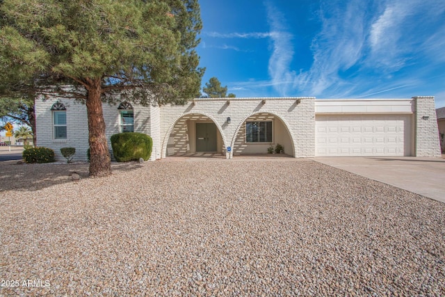 view of front of home featuring driveway and a garage