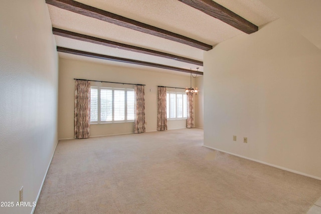 unfurnished room featuring baseboards, beam ceiling, a textured ceiling, carpet flooring, and a chandelier