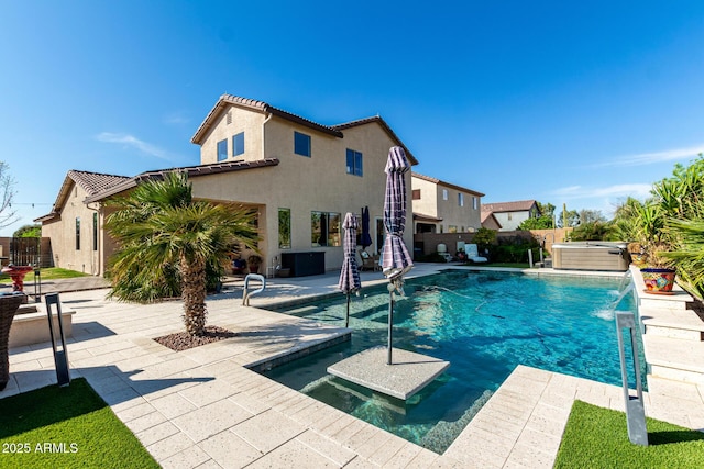 view of swimming pool with a fenced backyard, a fenced in pool, a patio area, and a hot tub