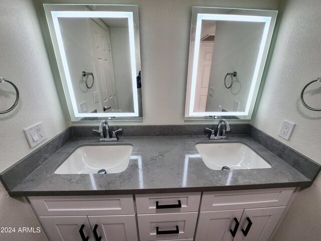 kitchen featuring appliances with stainless steel finishes, white cabinets, light tile patterned floors, and sink