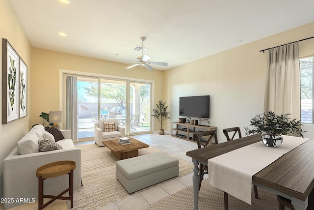 living room with light tile patterned floors and ceiling fan