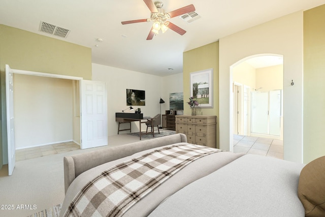 tiled bedroom featuring ceiling fan