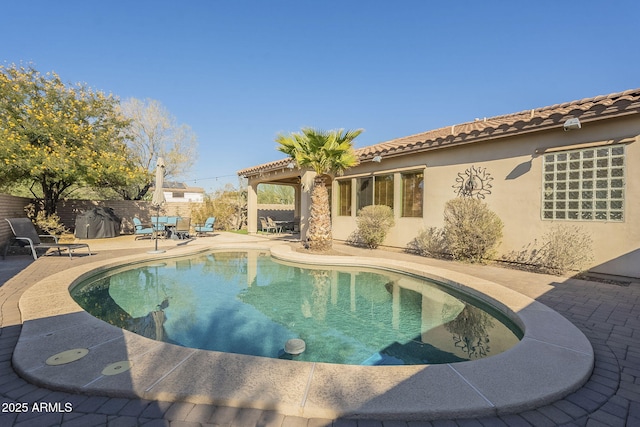 view of swimming pool featuring a patio area